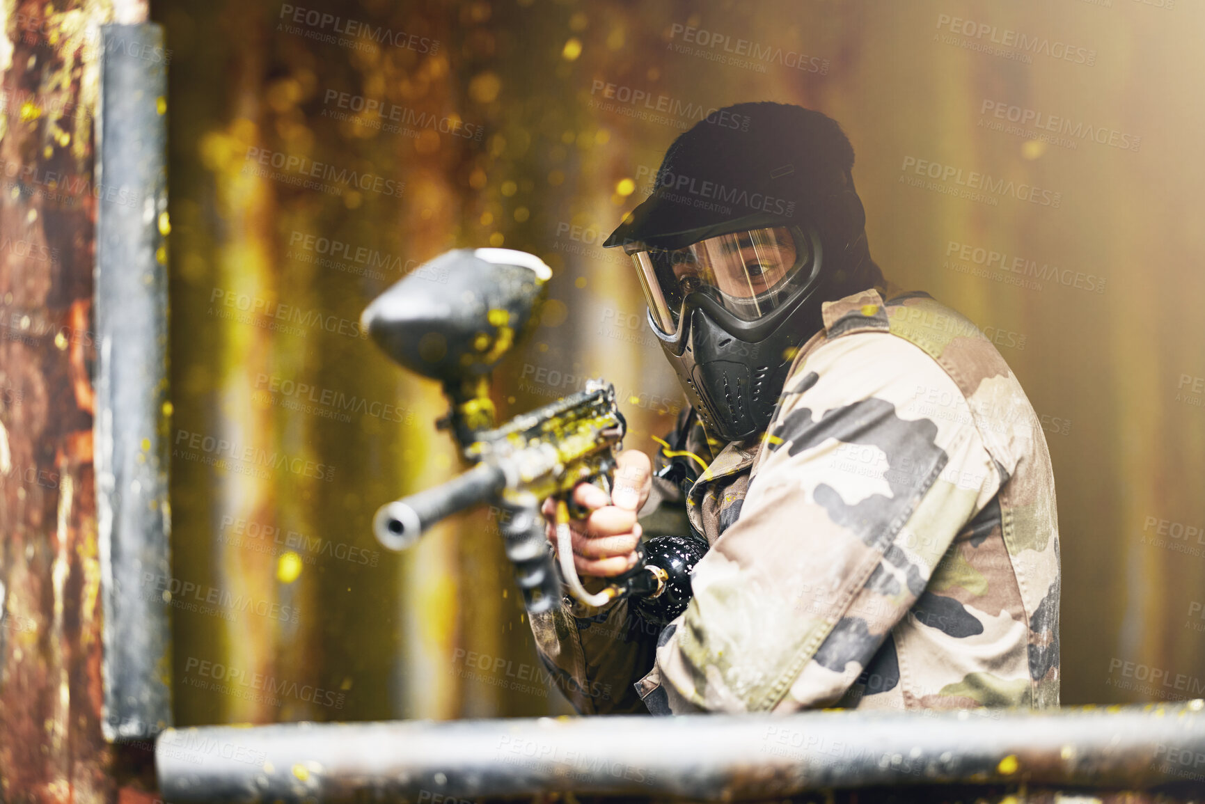Buy stock photo Paintball, war and camouflage with a sports man playing a military game for fun or training outdoor. Gun, soldier and target with a male athlete shooting a weapon outside during an army exercise