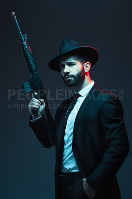 Buy stock photo Man, suit or automatic rifle on dark studio background in secret spy, isolated mafia or crime lord security. Model, gangster or thinking hitman and gun in stylish, trendy or fashion clothes aesthetic