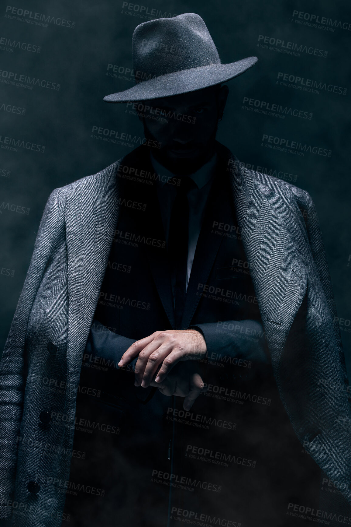 Buy stock photo Mafia, fashion and mystery man in a suit isolated on a dark background in a studio. Business, vintage and stylish secret businessman for crime investigation, spy work and agent on a backdrop