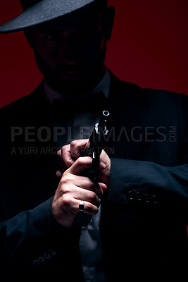 Buy stock photo Gangster, hands or cocking gun on studio background in dark secret spy, isolated mafia leadership or crime safety. Model, assassin or hitman weapon in ready, formal style or fashion clothes aesthetic