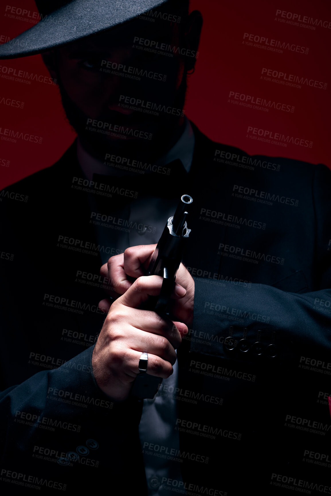 Buy stock photo Gangster, hands or cocking gun on studio background in dark secret spy, isolated mafia leadership or crime safety. Model, assassin or hitman weapon in ready, formal style or fashion clothes aesthetic