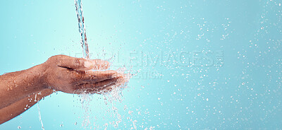 Buy stock photo Water stream, splash and black hands with mockup for cleaning and morning hand cleaning. Blue background, mock up and person with skincare, sustainable dermatology and clean health safety in studio