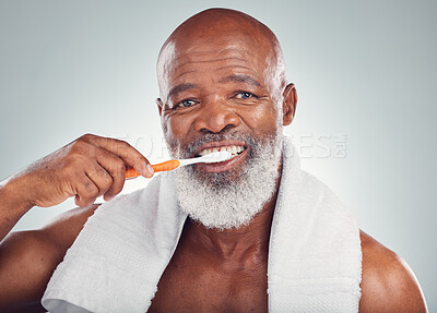 Buy stock photo Black man, dental hygiene and toothbrush with wellness, brushing teeth and smile on grey studio background. Oral health, African American male and guy clean mouth, fresh breath and grooming routine
