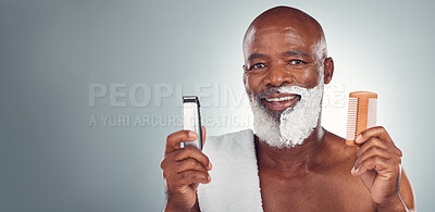 Buy stock photo Black man, beard and shaving with razor, cream or comb in cosmetics for skincare, grooming or self care against gray studio background. Portrait of happy African American male and shave kit on mockup