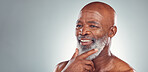 Senior black man, smile and beard in skincare for facial treatment, cosmetics or thinking on mockup. Happy elderly African American male smiling face in satisfaction against a grey studio background