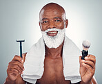 Black man, beard and razor for shaving, skincare or cosmetic cream for grooming or self care against gray studio background. Portrait of happy African American male with shave kit for clean facial