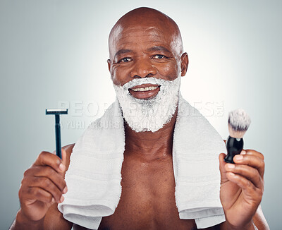 Buy stock photo Black man, beard and razor for shaving, skincare or cosmetic cream for grooming or self care against gray studio background. Portrait of happy African American male with shave kit for clean facial