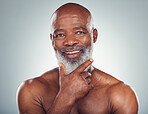 Portrait, black man and skincare for cosmetics, dermatology and guy on grey studio background. Face detox, African mature male and senior gentlemen with grooming routine, treatment and smooth skin