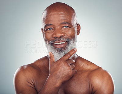 Buy stock photo Portrait, black man and skincare for cosmetics, dermatology and guy on grey studio background. Face detox, African mature male and senior gentlemen with grooming routine, treatment and smooth skin
