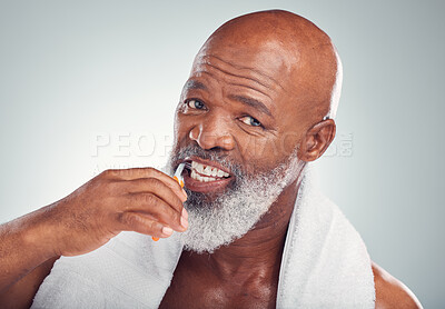 Buy stock photo Black man brushing teeth, portrait and toothbrush, mouth care and fresh breath, hygiene isolated on studio background. Health, wellness and cleaning with dental, senior person and retirement
