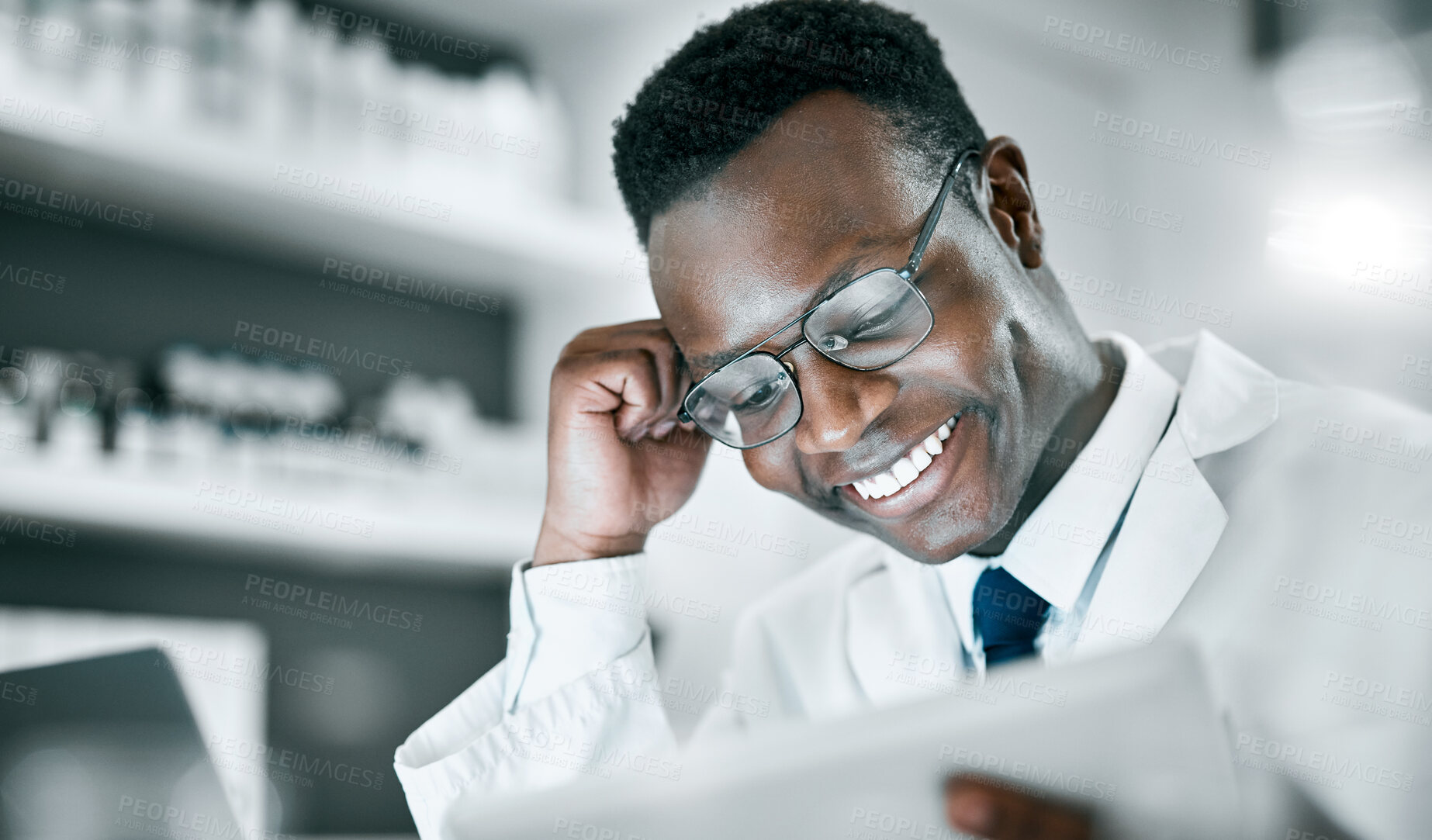 Buy stock photo Doctor, black man and tablet in lab for research, medical knowledge or happy for success, healthcare or career. Scientist, mobile touchscreen tech and focus for pharma innovation, motivation and goal