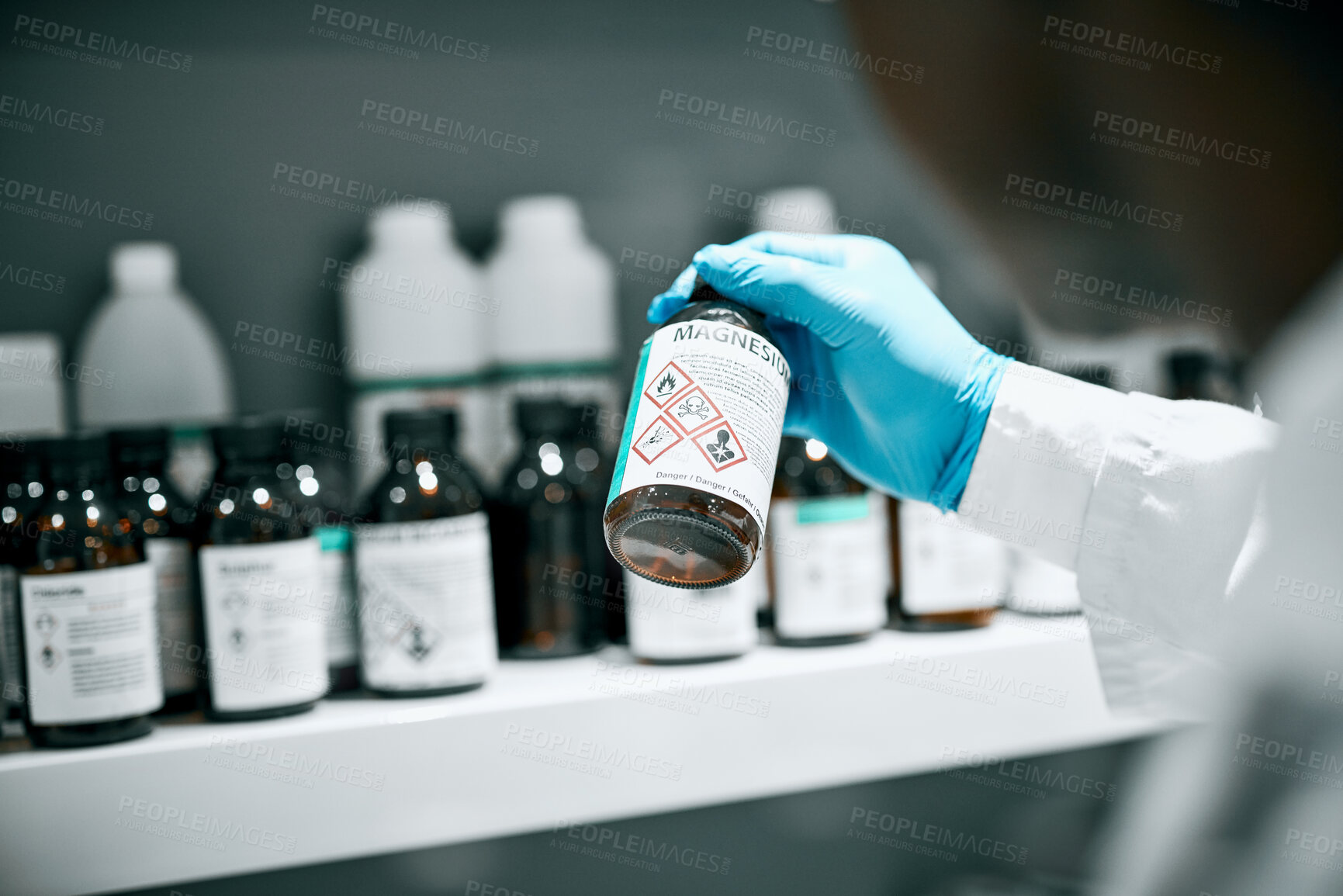 Buy stock photo Chemical, magnesium solution and chemistry worker hands in a laboratory for physics research. Medical lab, scientist and medicine experiment for biology, science and doctor test for education