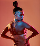 Portrait, art and neon with a model black woman in studio posing in underwear on an orange background. Aesthetic, beauty and fashion with an attractive young female standing on a kaleidoscope wall