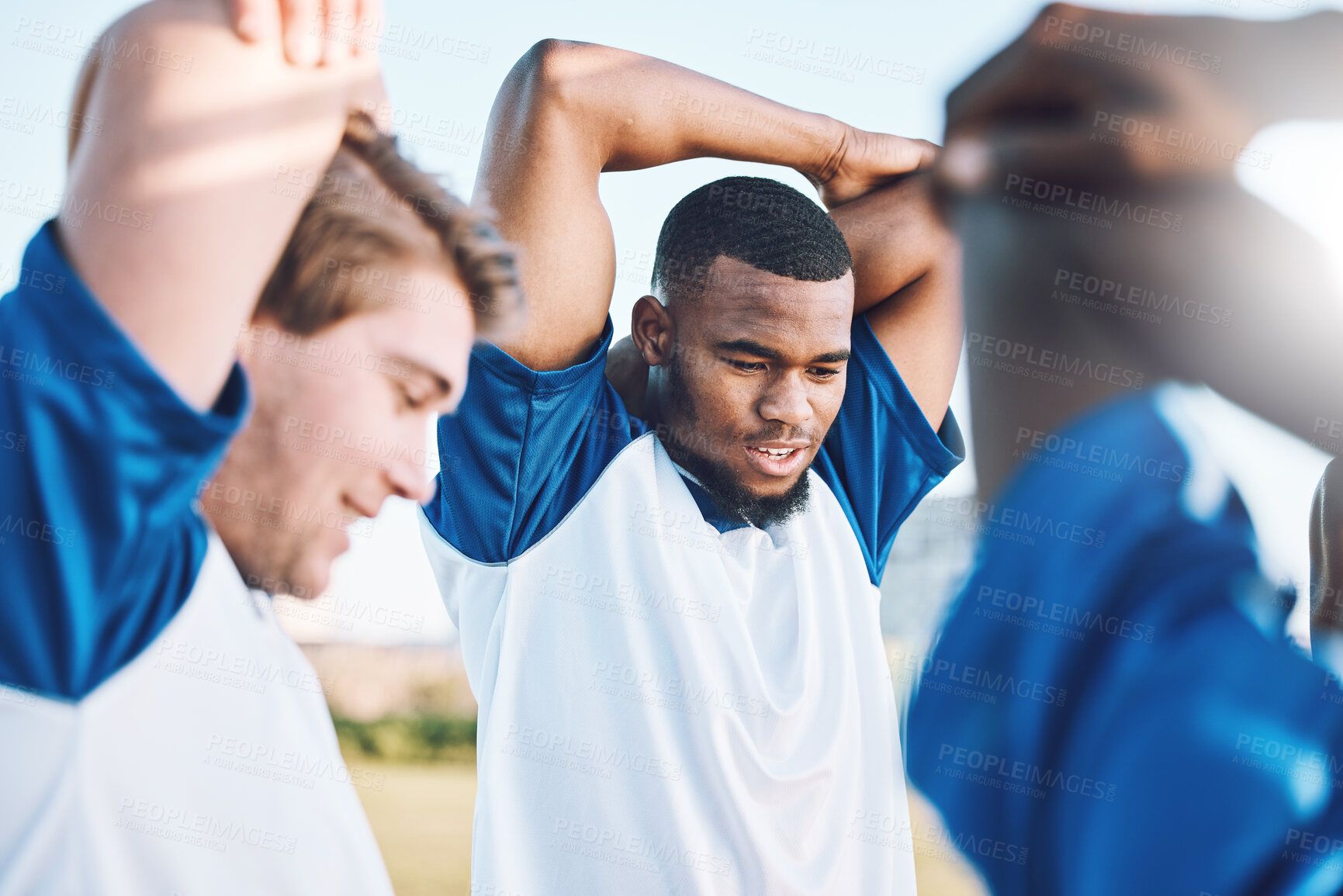 Buy stock photo Football, sports and stretching with a team outdoor on a field getting ready together for a competitive game. Soccer, fitness and warm up with a male sport group of friends on a pitch before a match