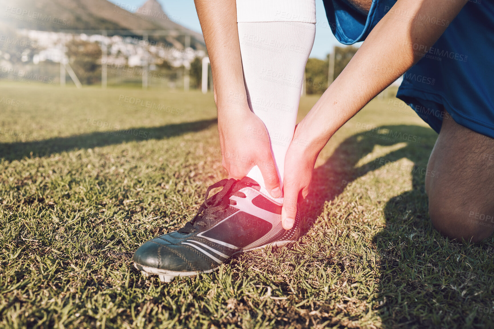 Buy stock photo Foot, red pain and hands of football player on field for medical emergency, risk or training problem on overlay. Feet, ankle or muscle injury of athlete on soccer pitch competition or game accident