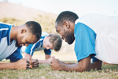 Buy stock photo Push up, team and football player coaching on field for training, practice and sports challenge and muscle power. Group of soccer people or men on grass or ground for workout with personal trainer
