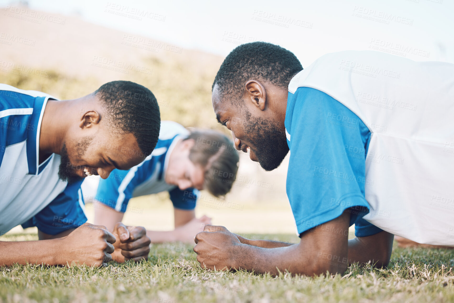 Buy stock photo Push up, team and football player coaching on field for training, practice and sports challenge and muscle power. Group of soccer people or men on grass or ground for workout with personal trainer