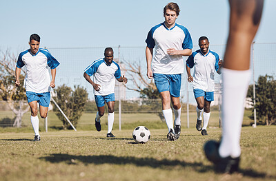 Soccer, ball and men team running during sports competition, training or game with teamwork. Football group people on a grass field for a goal, cardio performance and fitness achievement outdoor