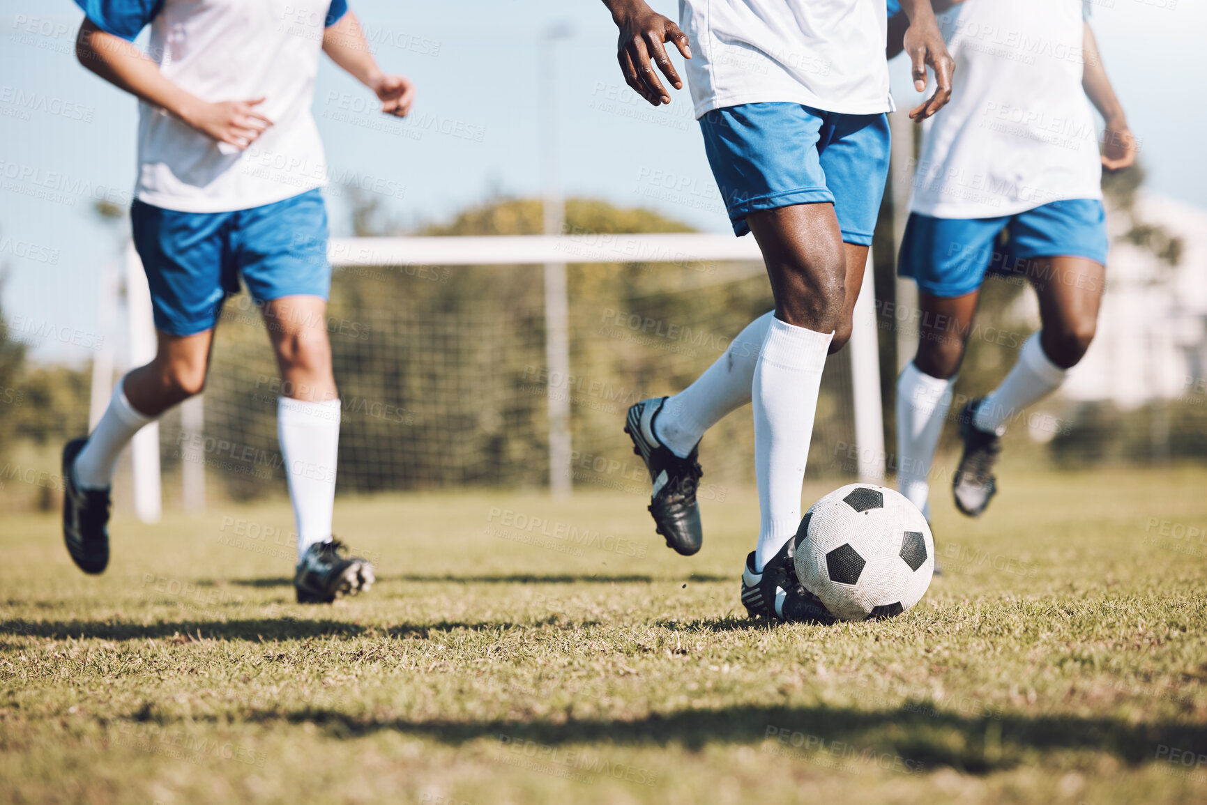 Buy stock photo Sports, running and men with a football on a field for training, competition and professional game. Teamwork, exercise and soccer players at a park for cardio, fitness action and workout in Brazil