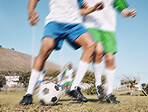 Football, challenge and motion blur with a sports man running on a field during a competitive game or training. Soccer, fitness or health and a male athlete or player on a pitch with an opponent