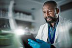 Black man, tablet or thinking in science laboratory for medical research, innovation or ideas for genetic engineering. Plant scientist, worker or biologist with technology for sustainability research