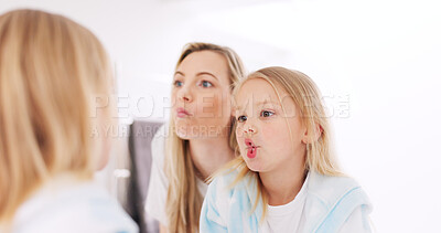 Buy stock photo Happy, funny faces and mother with a child looking in the mirror while making a comic joke. Happiness, smile and young mom having comedy fun with her daughter at their family home in Australia.