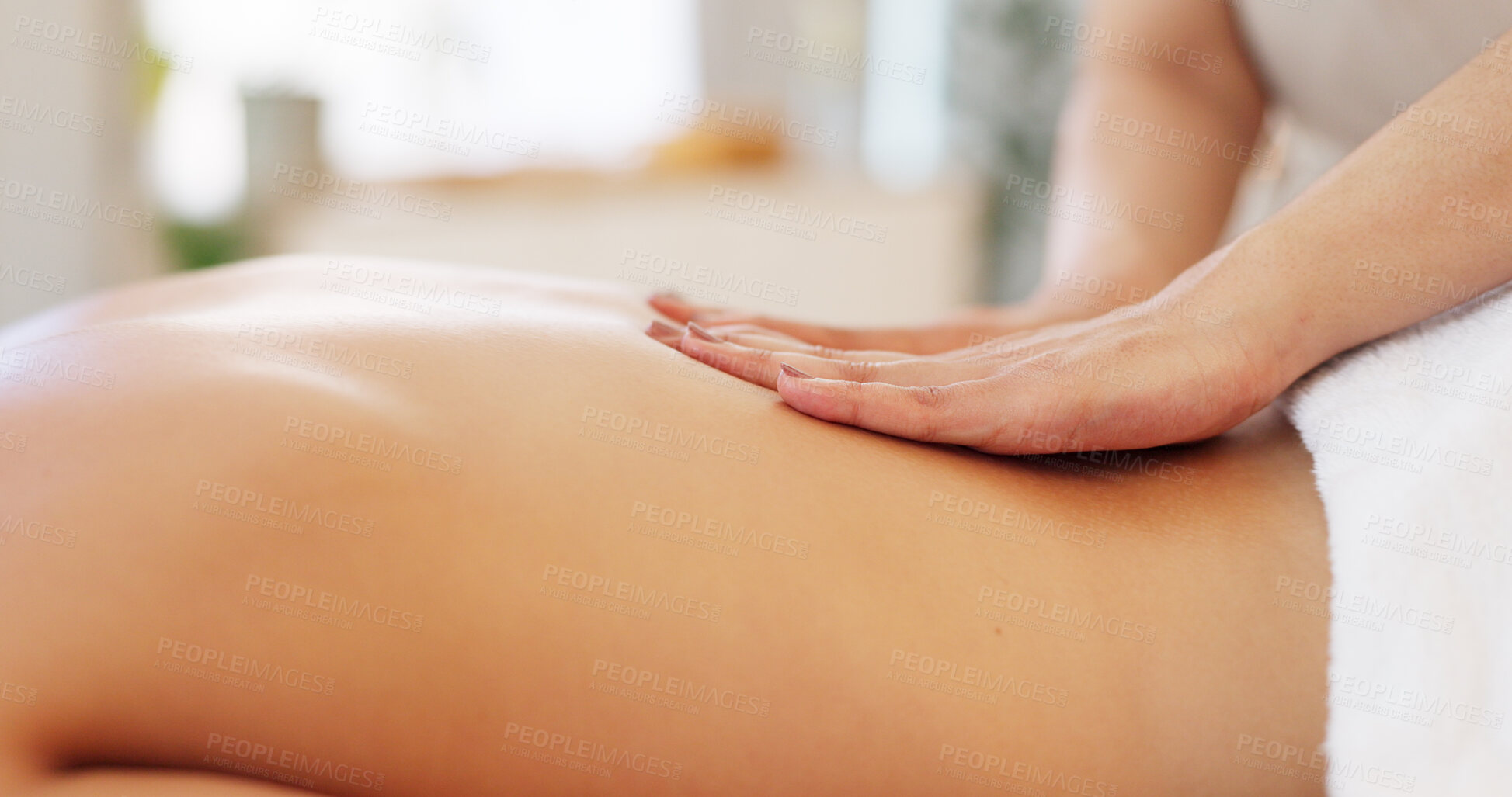 Buy stock photo Hands, back massage and a person on a spa table for wellness, luxury treatment or stress relief closeup. Relax, health and skin with a beauty therapist massaging a customer at a resort or salon