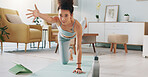 Yoga, tablet and woman with online video for stretching exercise in the living room of her house. Girl with balance during fitness workout on the internet with tech in the lounge of her home
