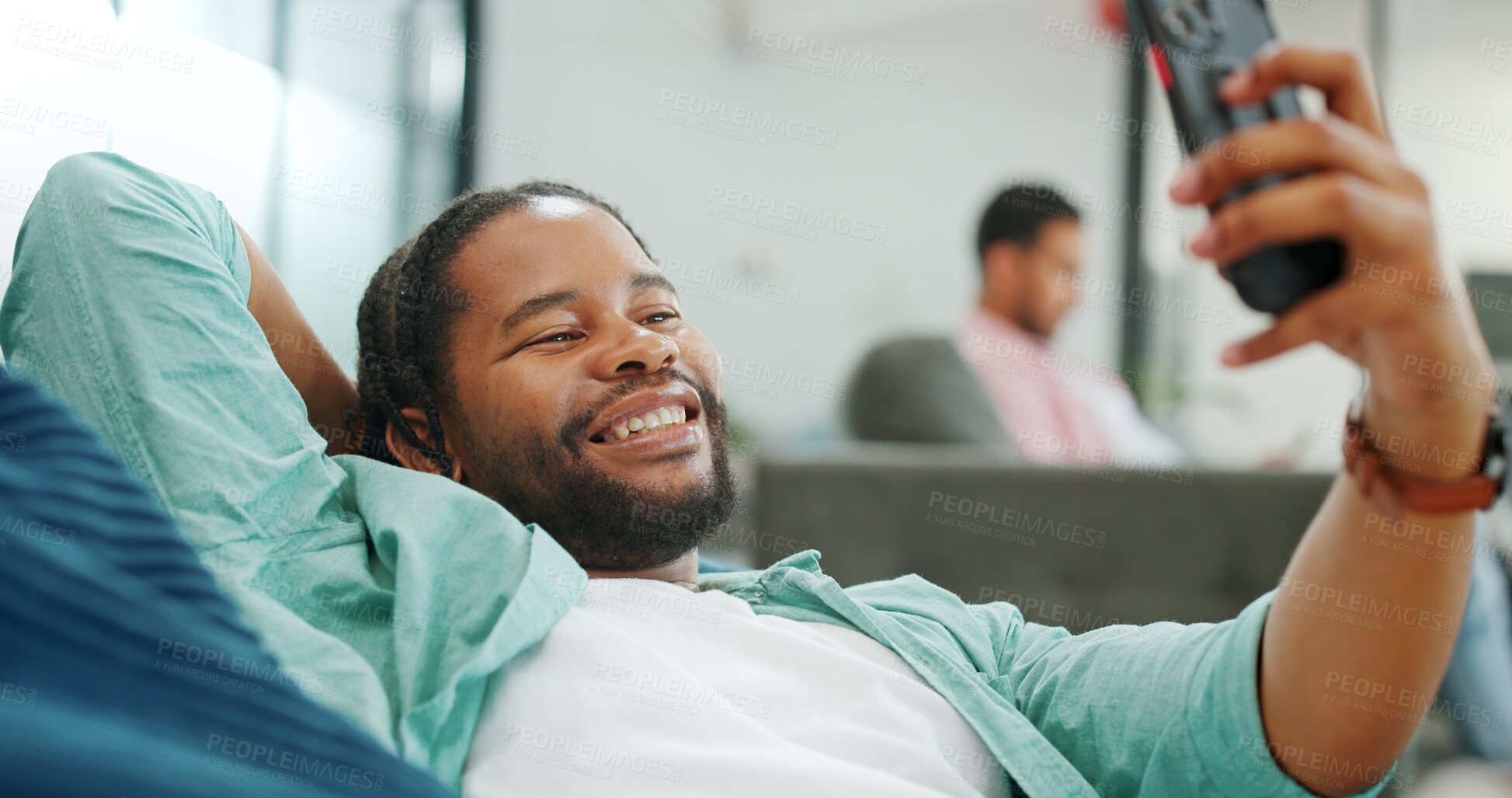 Buy stock photo Couch, selfie and black man on video call with smile on, social media, networking or communication at the office. Connection, happy and person relax on break talking on mobile app conversation