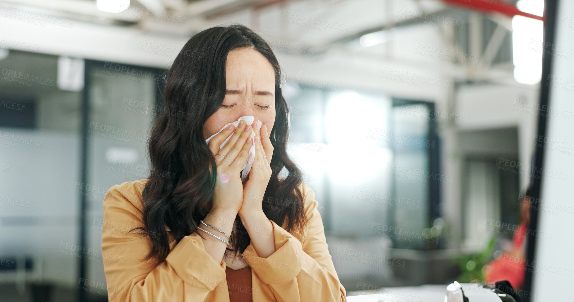 Buy stock photo Office, tissue and Asian woman sick with flu, cold or covid virus infection while working at computer. Healthcare problem, sneeze and girl with allergy in workplace, blowing nose and corona symptoms.