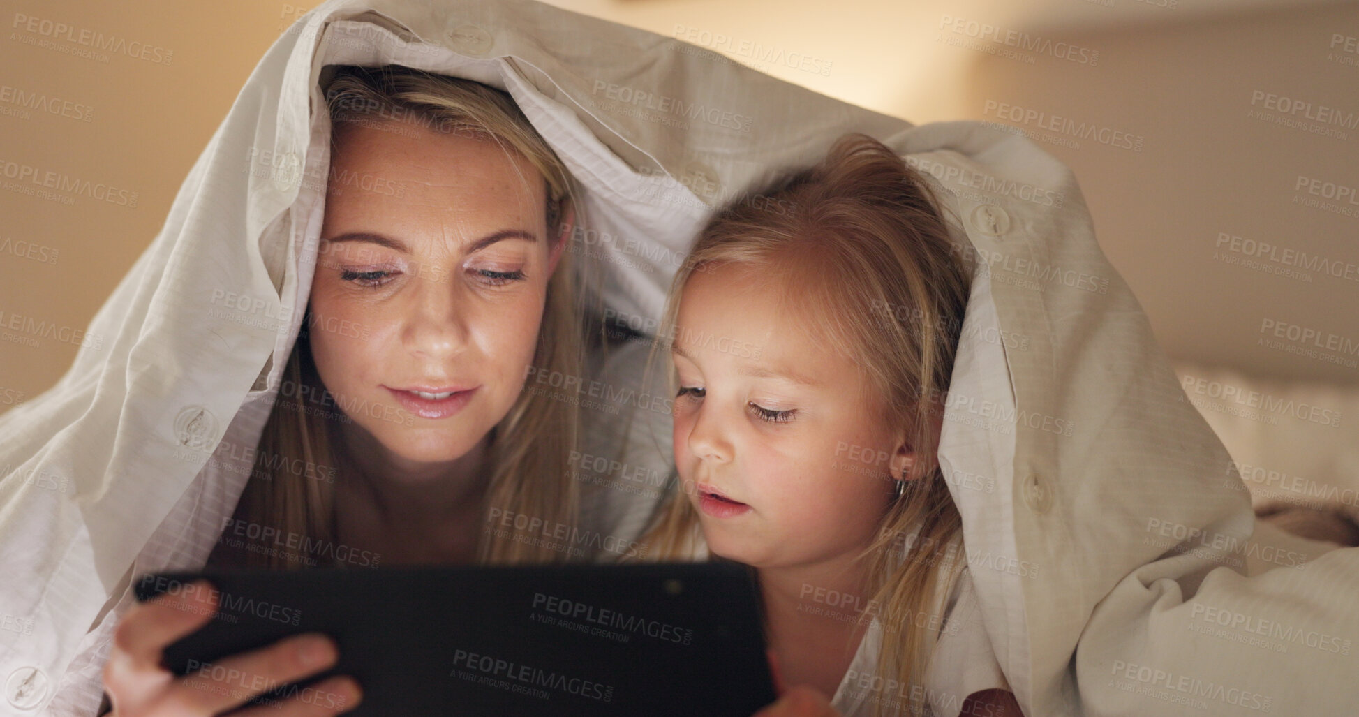 Buy stock photo Bed, mother and girl with tablet, blanket fort and connection with social media, streaming movie and bonding. Family, mama and kid with technology, bedroom and home with digital app, games and relax