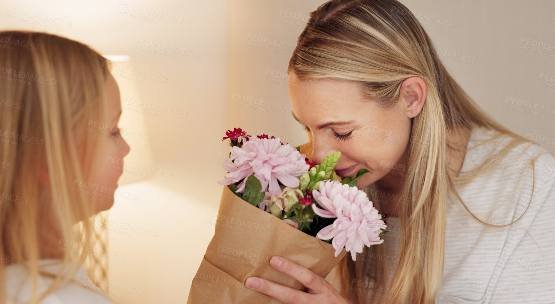 Buy stock photo Mothers day gift, smell flowers and child in congratulations for birthday of family bonding together in home. Bouquet sniff, present of girl and mom smile in gratitude, love and celebration of women.