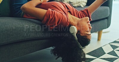 Headphones, listening and dance of black woman on a sofa excited for subscription service, technology and home connection. Happy, relax and girl portrait dancing on couch while listening to music app