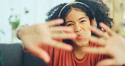 Black woman, dancing and headphones on sofa, being content and singing words in living room. Young girl, headset and digital device for contemporary dancer, moving with rhythm and relax on break.