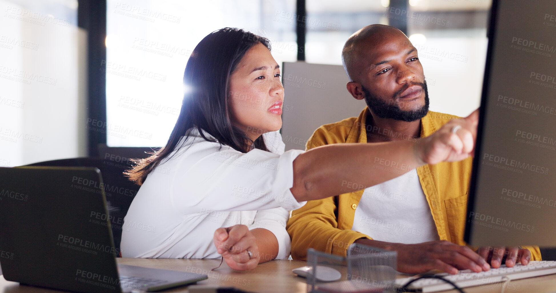 Buy stock photo Computer, collaboration and black man with woman planning a digital marketing strategy, project or teamwork in office. Helping, employee and reading social media, SEO or research online together