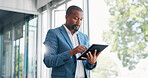 Business man, tablet and thinking in office lobby while browsing internet, social media or researching. Technology, idea and black man with digital touchscreen for web scrolling, networking or email.