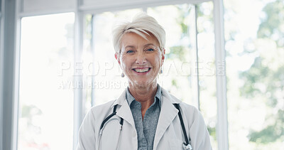 Face, senior woman and doctor for healthcare, wellness or medicine. Mature female, portrait or medical professional with smile, leader or confident with uniform, stethoscope or motivation in hospital