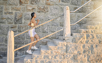 Buy stock photo Fitness, podcast or woman running on steps for cardio workout, training or body exercise at sunrise in summer. Brazil, wellness or girl athlete exercising or walking on stairs streaming radio music