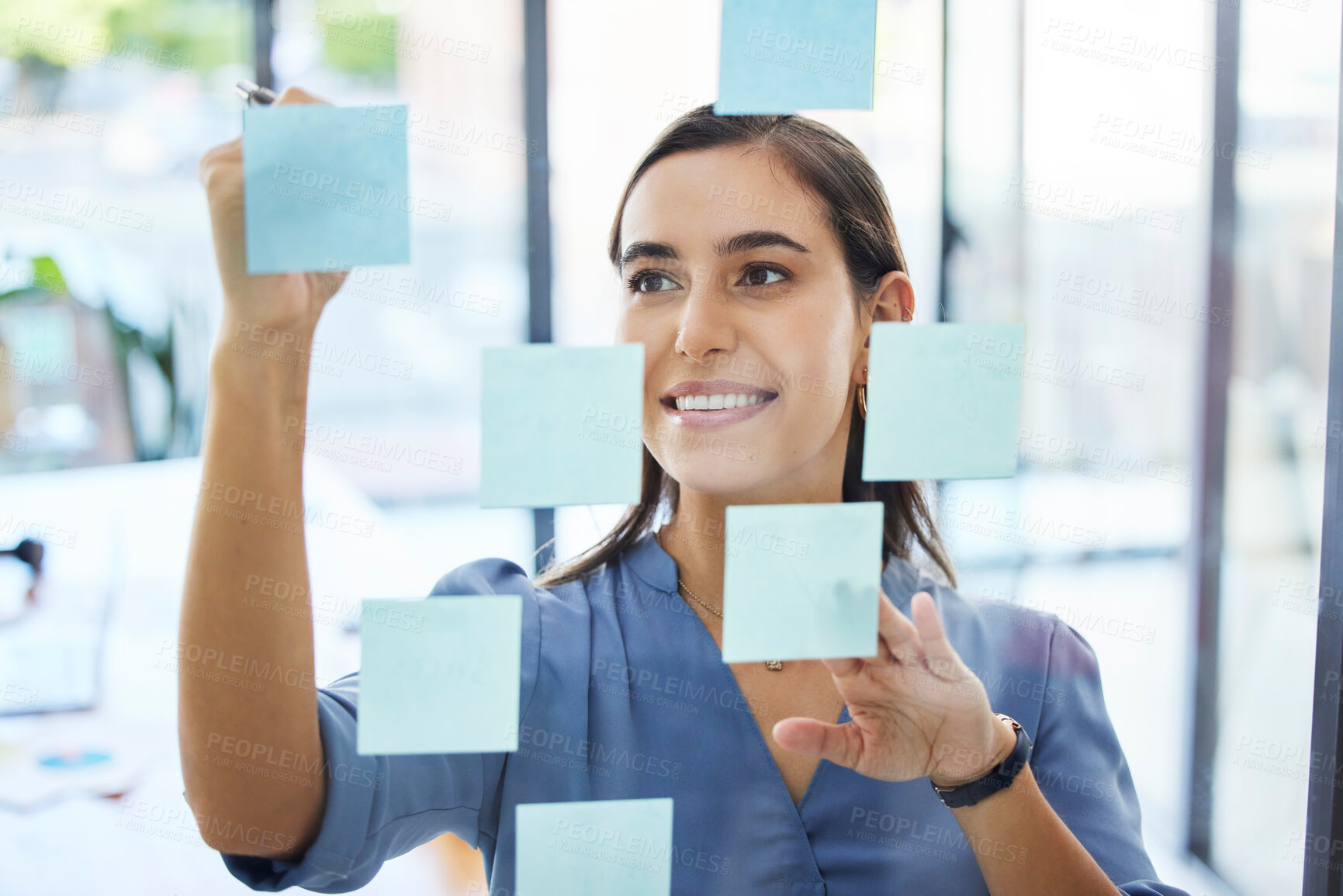 Buy stock photo Business woman, brainstorming and planning schedule for goals, agenda and vision on office window. Happy young worker writing solution, sticky note ideas and strategy for company in startup agency 