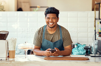 Buy stock photo Barista portrait, cafe black man on a phone for happy online sales, small business management or ecommerce. Smile waiter, cashier or worker person on smartphone, technology or service in restaurant