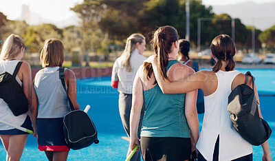 Buy stock photo Women, hockey and teamwork on field together with support, solidarity or walking to fitness training with coach. Sports group, friends and walk from workout, outdoor exercise or hug with conversation