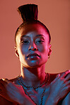 Portrait, face and makeup with a model black woman in studio on a neon background for beauty. Art, kaleidoscope and style with an attractive young female posing indoor for culture or cosmetics