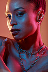 Portrait, makeup and closeup with a model black woman in studio on a neon background for beauty. Art, kaleidoscope and style with an attractive young female posing indoor for culture or cosmetics