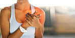 Hands, heart attack and health with a sports woman suffering from cardiac arrest outdoor during a workout. Fitness, chest pain and emergency with a female athlete holding her body for cardiology