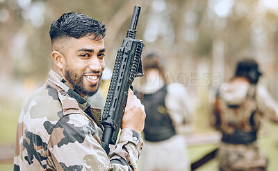 Buy stock photo Paintball gun, man and portrait with smile, camouflage clothes and excited to start military combat game. Army training, warfare games and adventure for workout, shooting and challenge with friends
