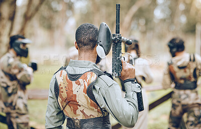 Buy stock photo Paintball, gun and back of man in woods ready for games, arena match and shooting battle outdoors. Extreme sports, adventure and male with weapon in camouflage, military clothes and action gear