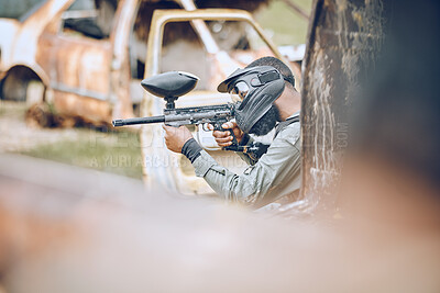 Action, paintball and target with man in field for sports, fitness and shooting games. War, soldier and adventure with gamer playing in camouflage for military, army and competition training