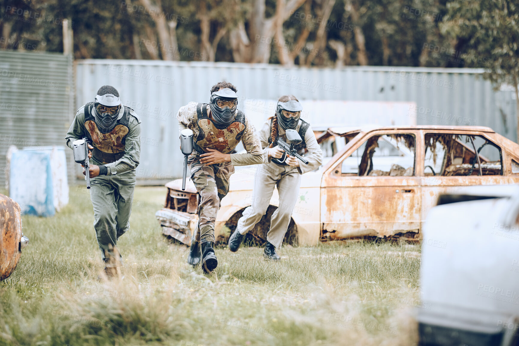 Buy stock photo Paintball, mission or men running in a shooting game playing with speed or fast action on a fun battlefield. Focus, military or players with guns or weapons for survival in an outdoor competition 