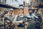Paintball, team portrait or gun for a sports game, competition or challenge for action. Diversity men and women group for military, soldier or army mission in outdoor war battlefield with teamwork