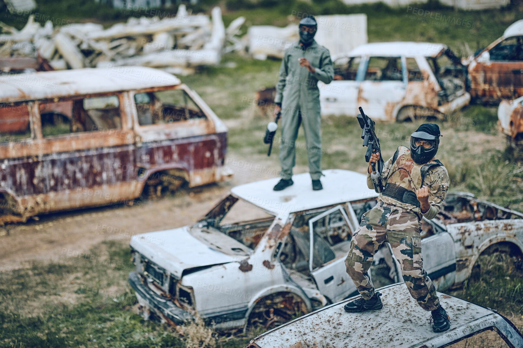 Buy stock photo Paintball, winner and celebration with a sports man on a car in a battlefield during army training for the military. War, victory and motivation with a male soldier celebrating winning during a game